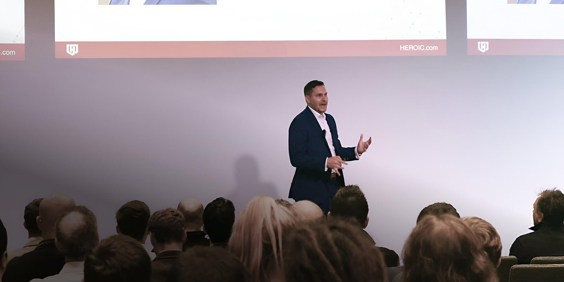 Chad Bennett speaking on stage